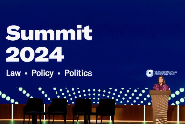 Main stage screen reading Summit 2024: Law, Policy, Politics